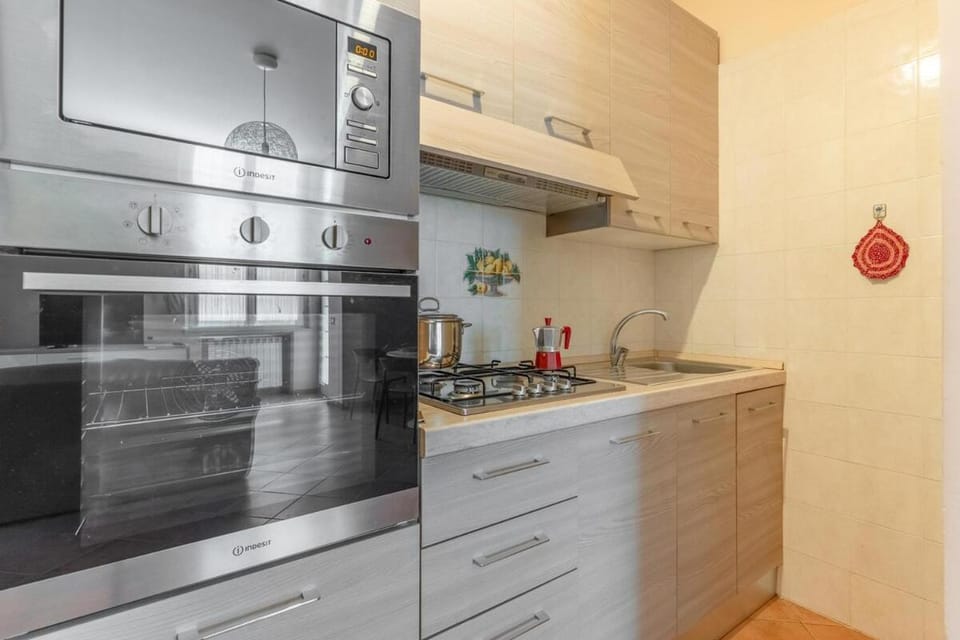 Kitchen or kitchenette, dishwasher, oven, stove