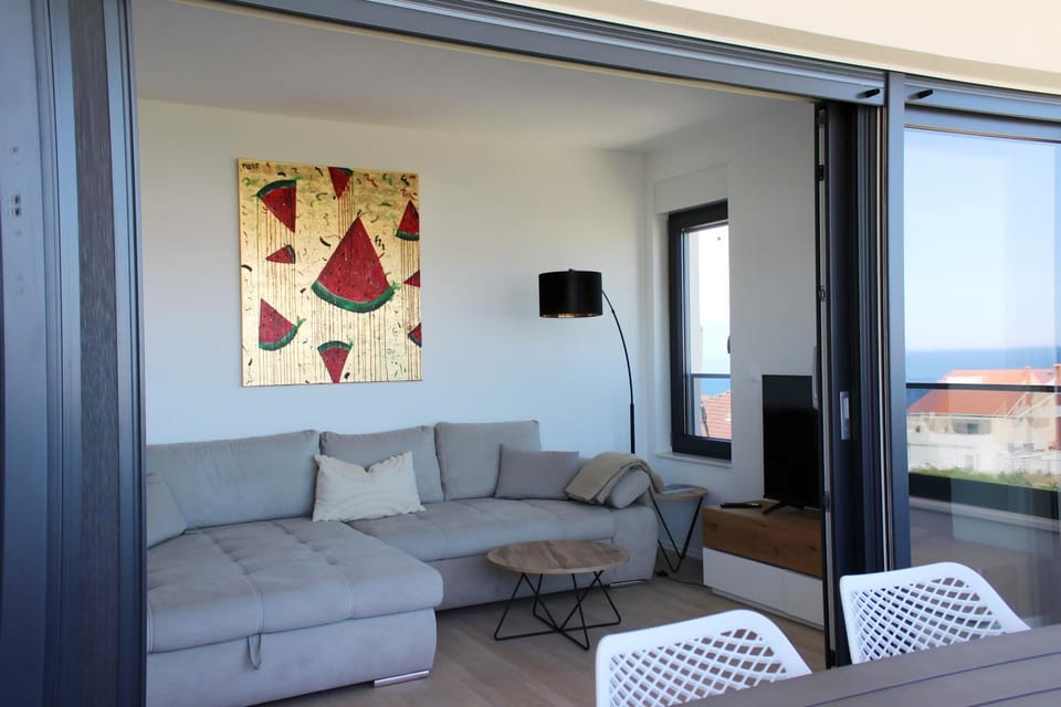 TV and multimedia, View (from property/room), Living room, Seating area, Sea view