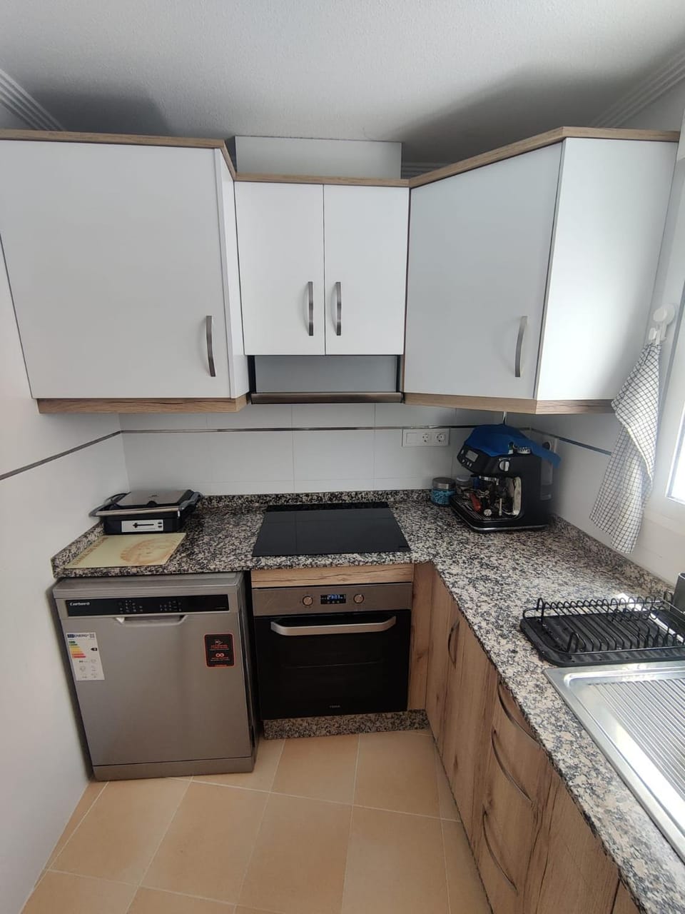 Kitchen or kitchenette, dishwasher, oven, stove