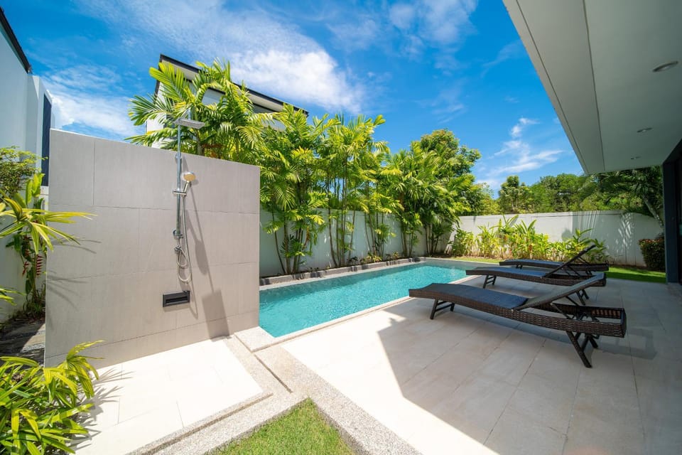 Modern minimalist style luxury villa with private pool located in a high-end resort area adjacent to Laguna Park Golf Course Villa in Choeng Thale