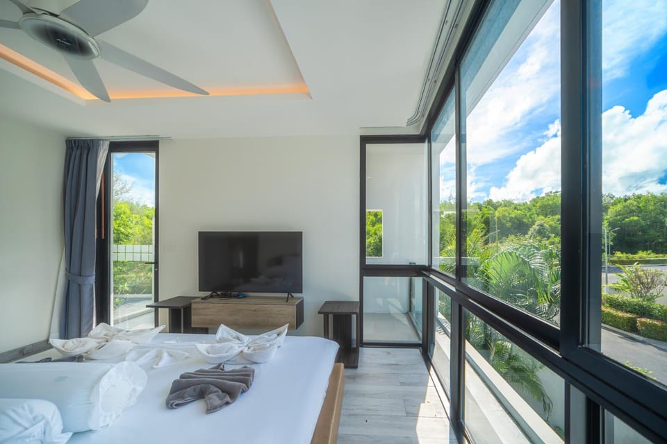 Modern minimalist style luxury villa with private pool located in a high-end resort area adjacent to Laguna Park Golf Course Villa in Choeng Thale