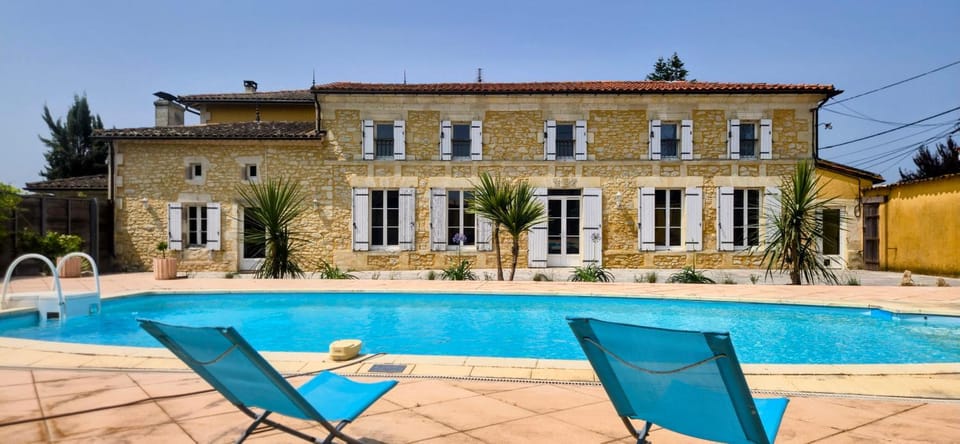 Property building, Patio, Pool view, Swimming pool, sunbed
