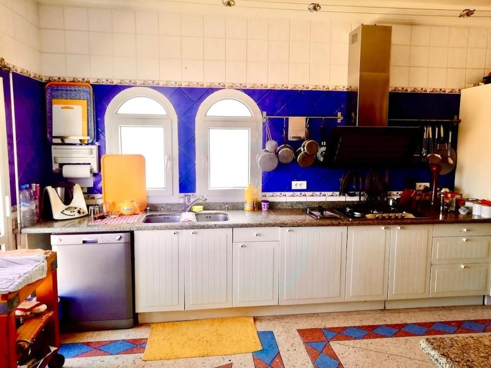 Kitchen or kitchenette, dishwasher, oven, stove