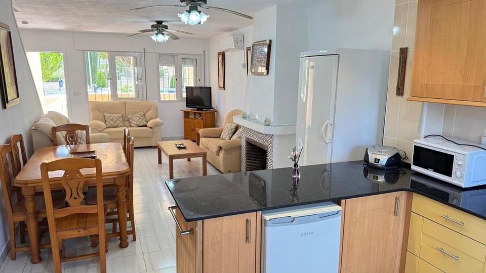 Kitchen or kitchenette, Living room, Seating area, Dining area, dishwasher, fireplace