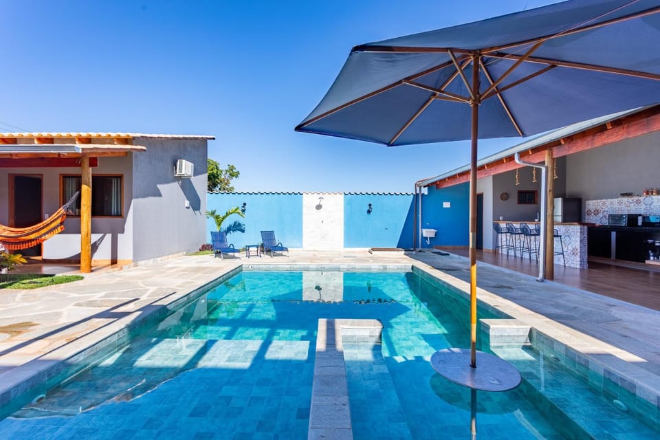 Property building, Patio, Pool view, Swimming pool, sunbed