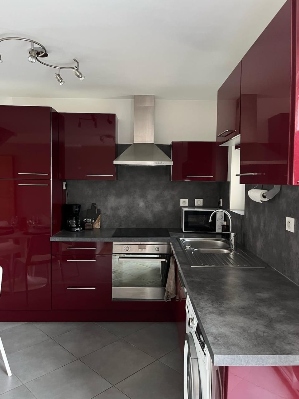 Kitchen or kitchenette, dishwasher, microwave, oven, stove, washing machine