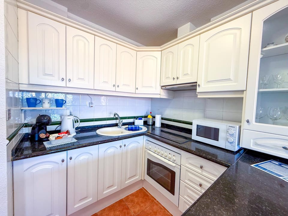 Kitchen or kitchenette, oven, stove