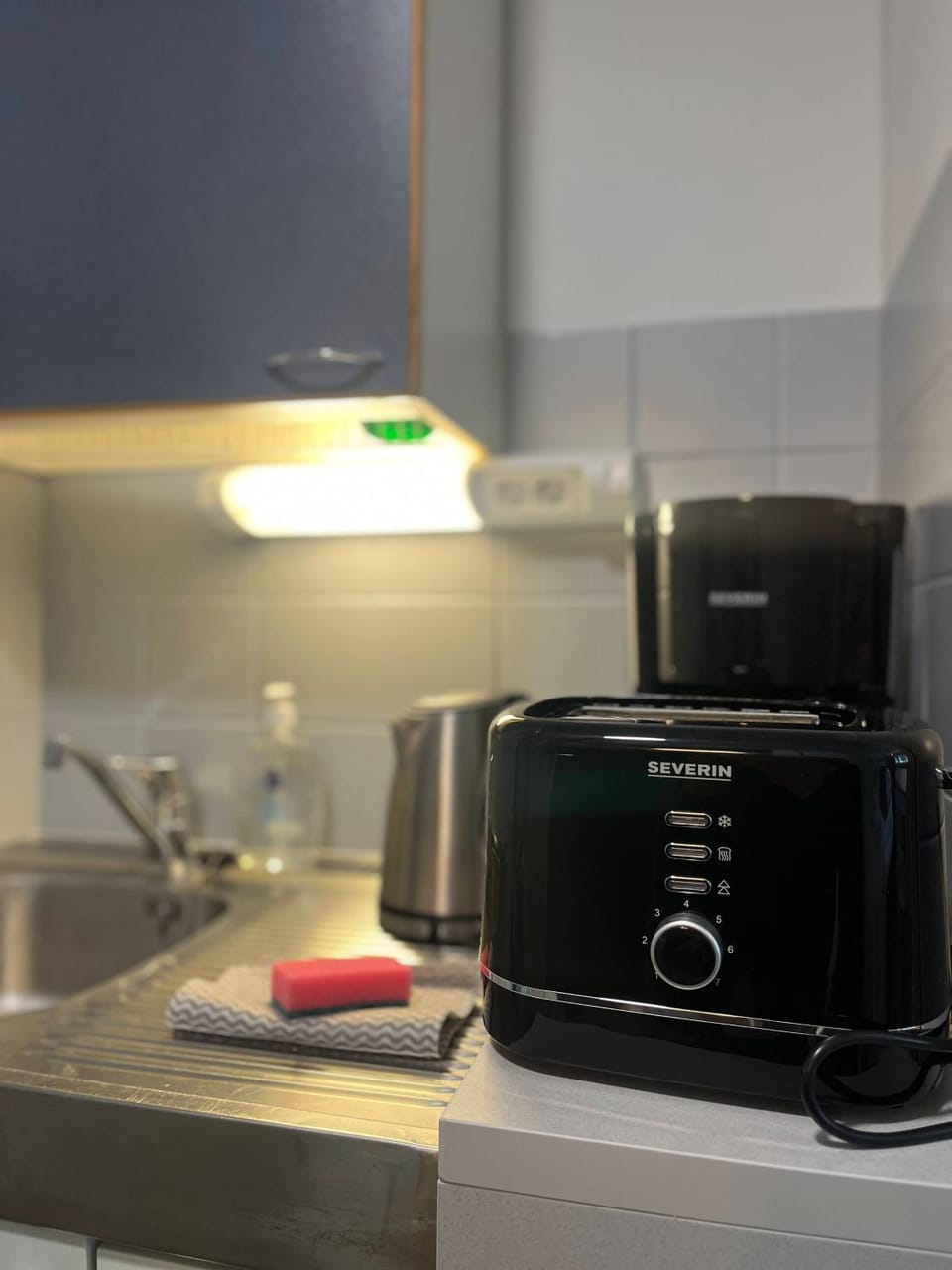Kitchen or kitchenette, toaster