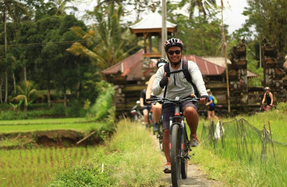 Downhill Cycling Ubud with Volcano, Jungle, Rice Terrace with meals Docked boat in Tampaksiring