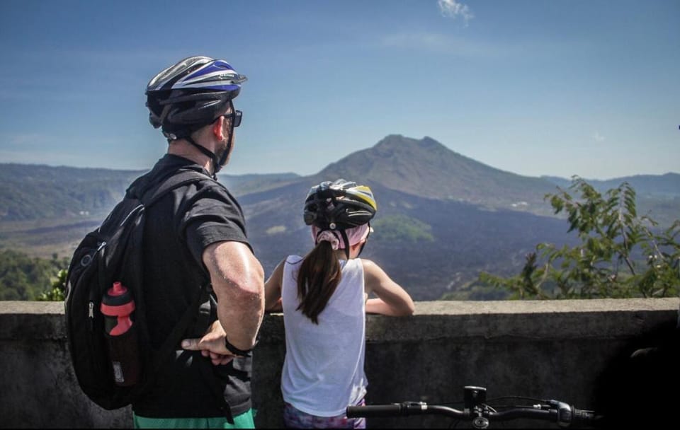 Downhill Cycling Ubud with Volcano, Jungle, Rice Terrace with meals Docked boat in Tampaksiring
