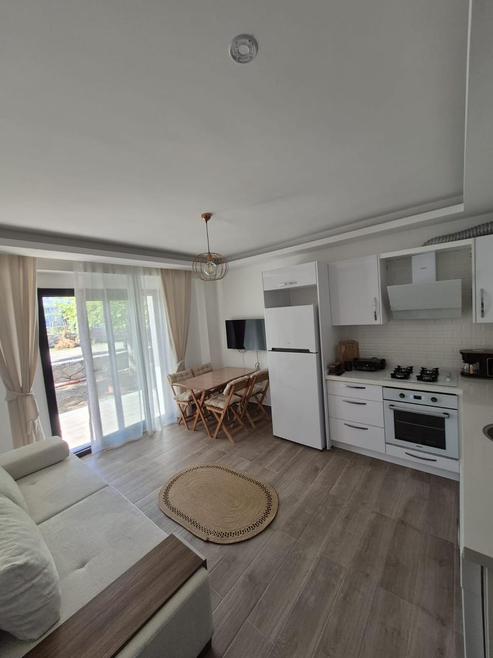 Coffee/tea facilities, Living room, Photo of the whole room, Seating area, dishwasher, stove, toaster