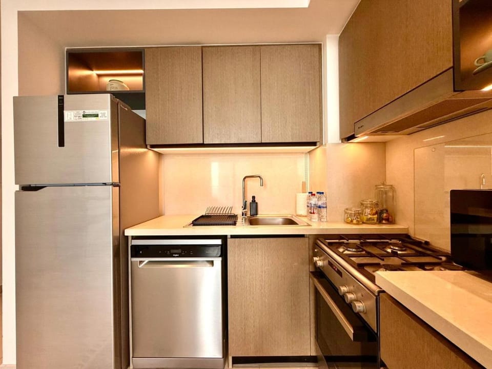 Kitchen or kitchenette, dishwasher, oven, stove