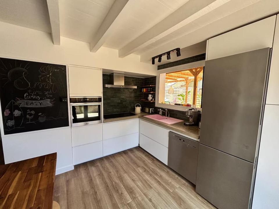 Kitchen or kitchenette, dishwasher, oven, stove