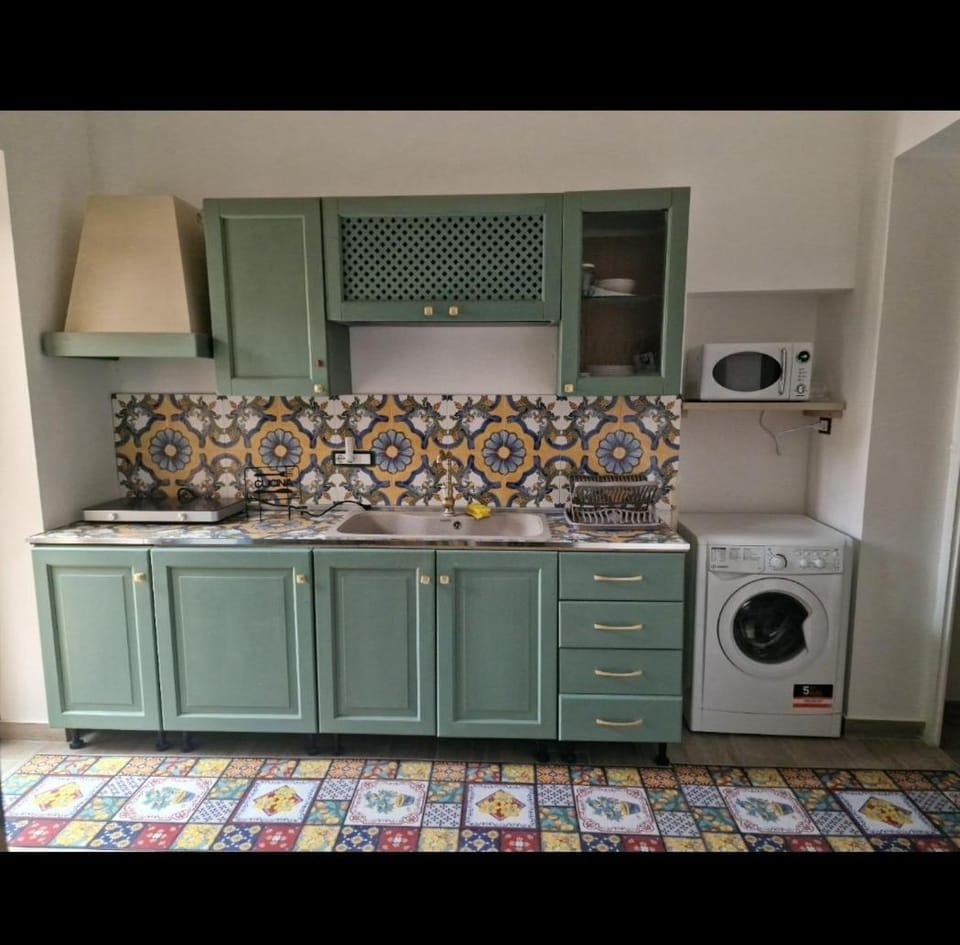 Kitchen or kitchenette, stove, washing machine