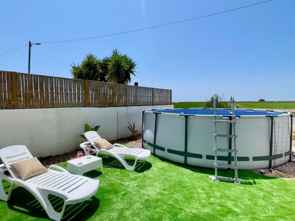 Patio, Day, Natural landscape, Pool view, Swimming pool, sunbed