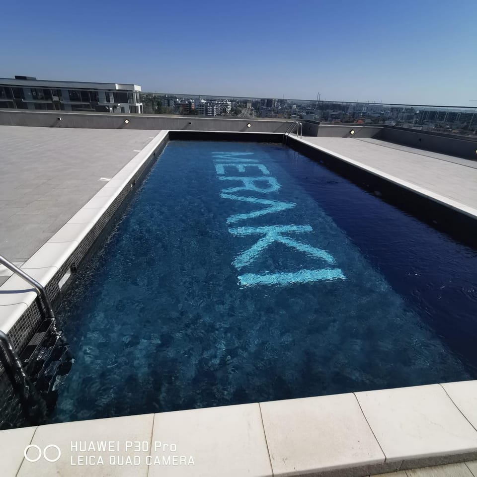 Day, Text overlay, Swimming pool