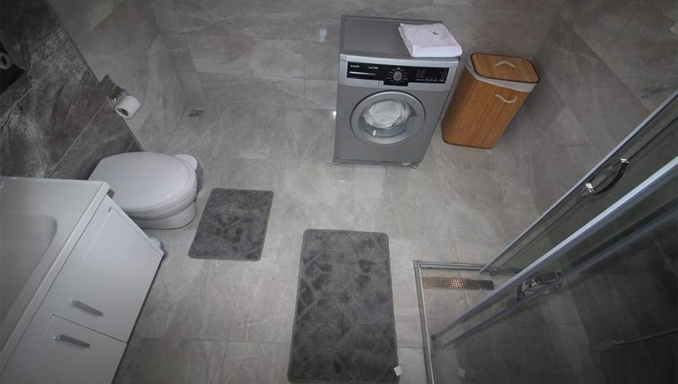 Shower, Toilet, Bathroom, towels, washing machine, dryer
