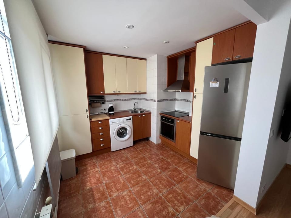 Kitchen or kitchenette, oven, stove, washing machine