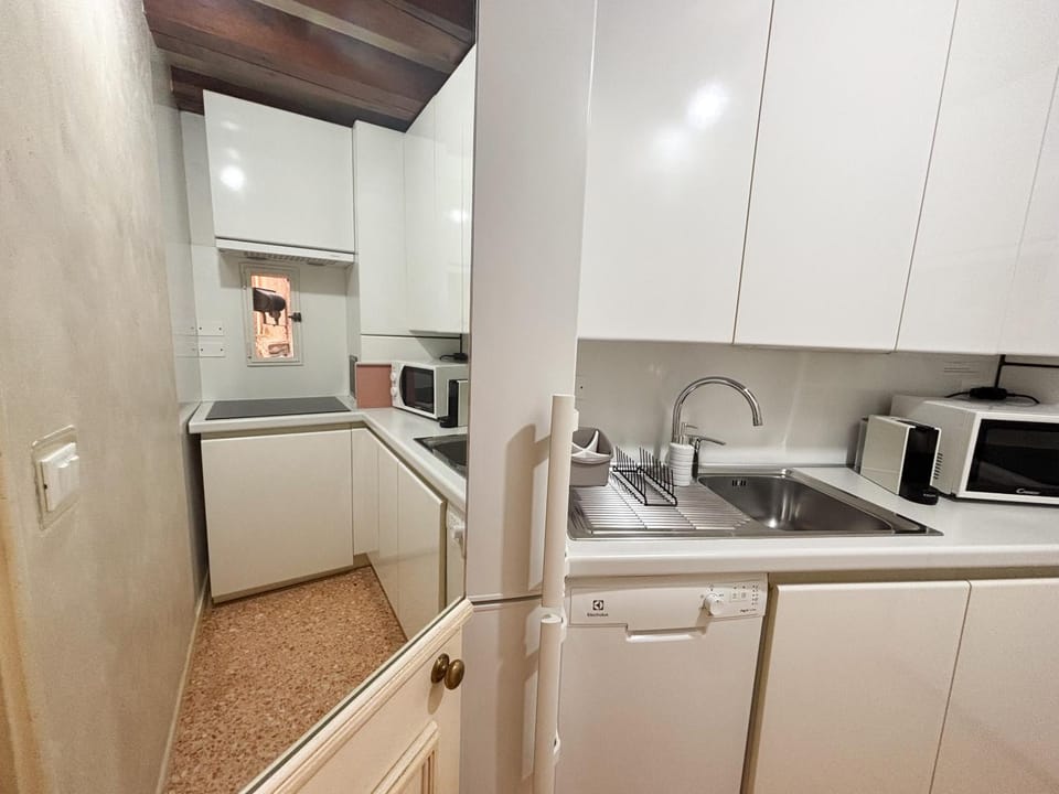 Kitchen or kitchenette, dishwasher, oven, stove, toaster