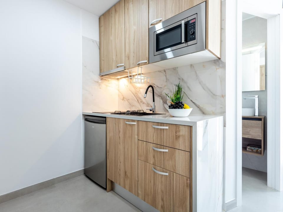 Kitchen or kitchenette, dishwasher, oven, stove