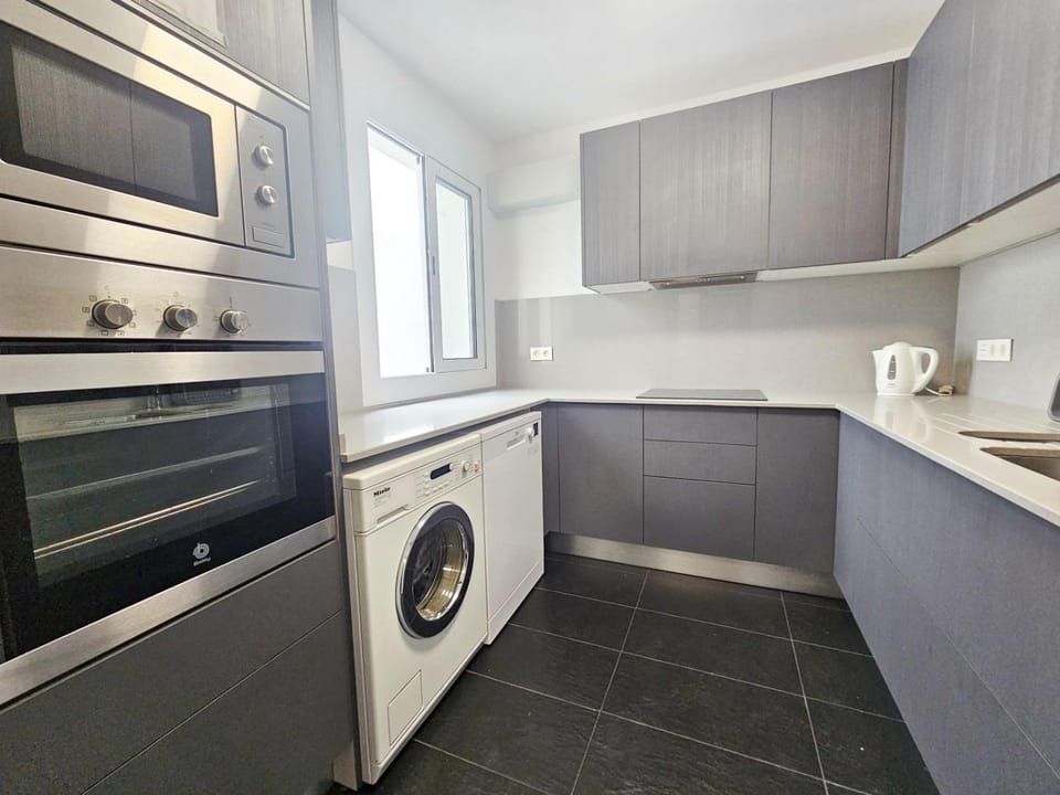 Kitchen or kitchenette, dishwasher, oven, stove, toaster