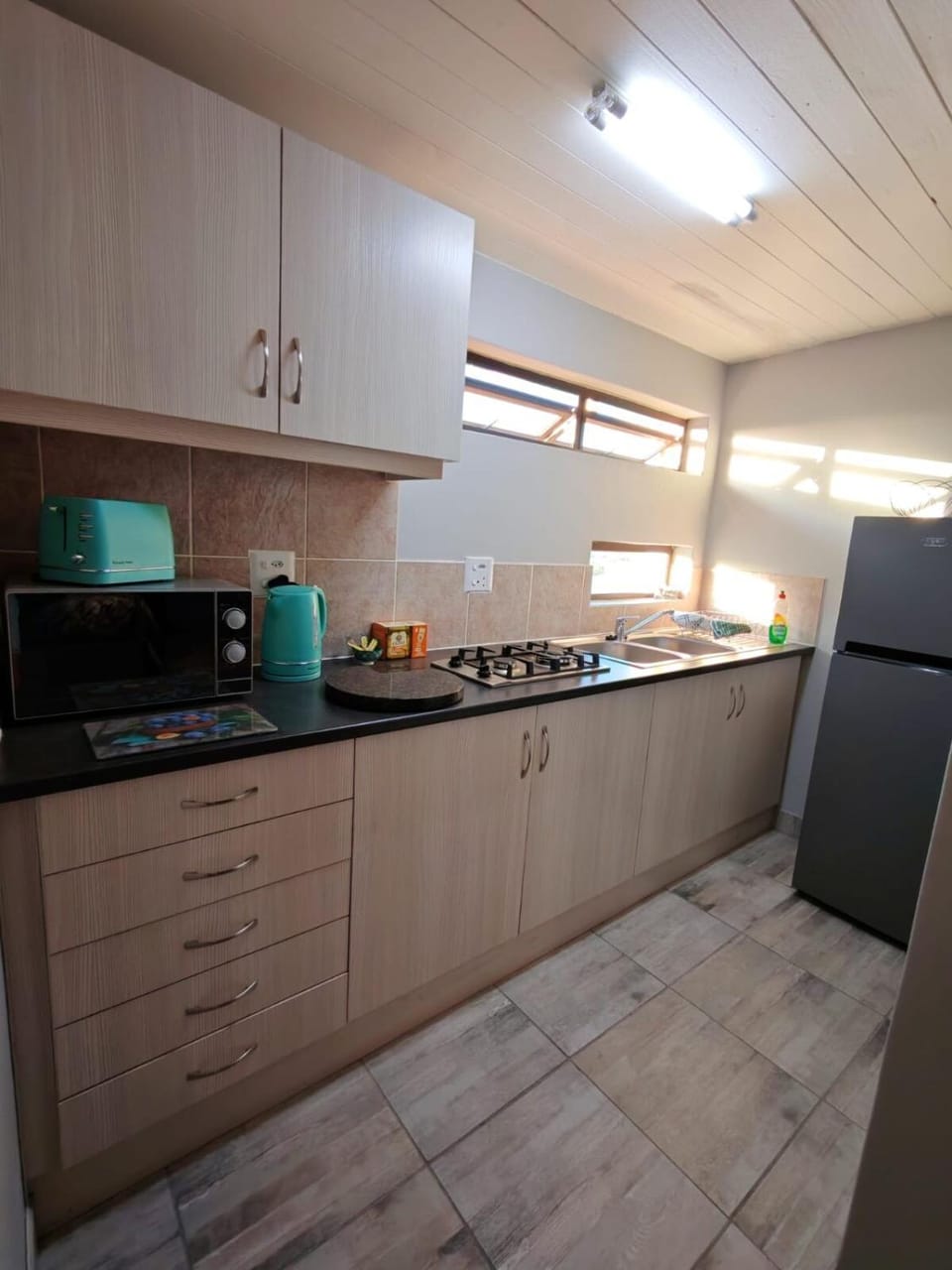 Kitchen or kitchenette, microwave, stove