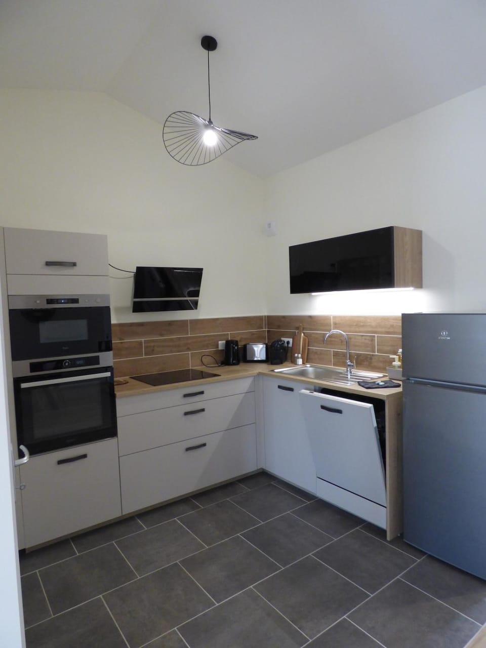 Kitchen or kitchenette, dishwasher, oven, stove, toaster