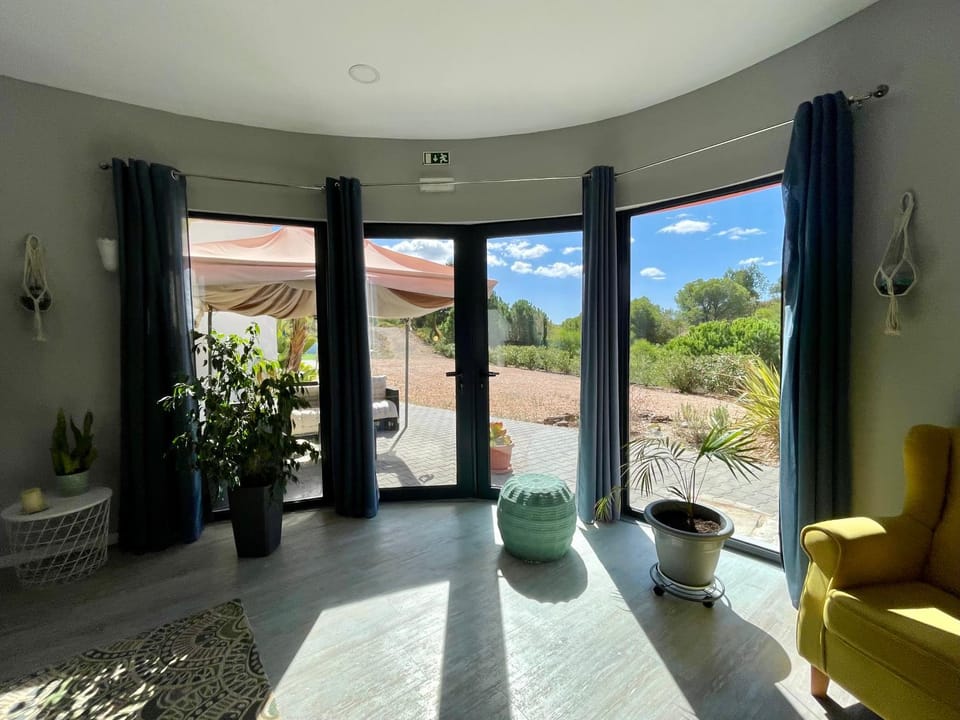 Natural landscape, View (from property/room), Living room, Seating area, Garden view