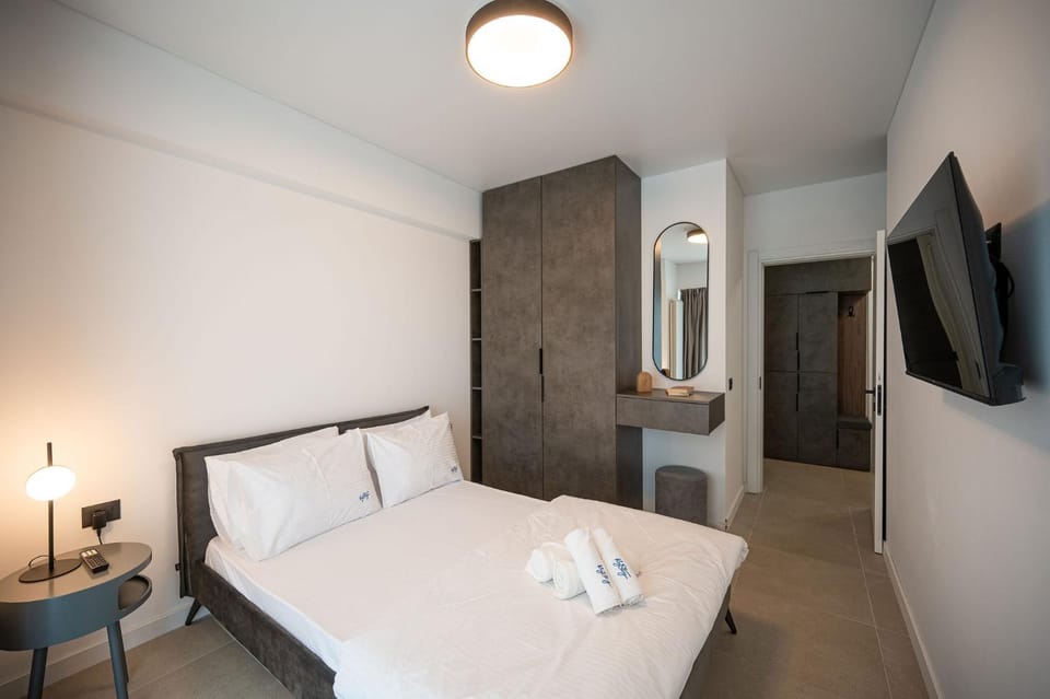 Bed, towels, wardrobe