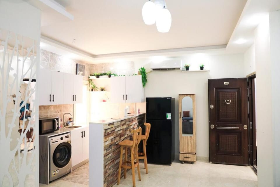 Kitchen or kitchenette, stove, washing machine