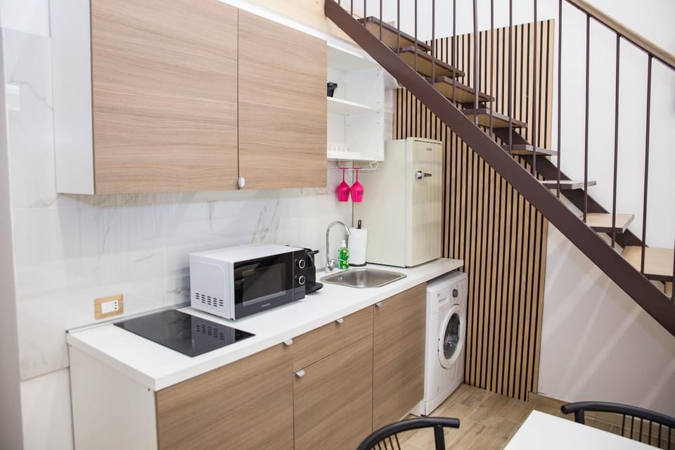 Kitchen or kitchenette, stove, washing machine