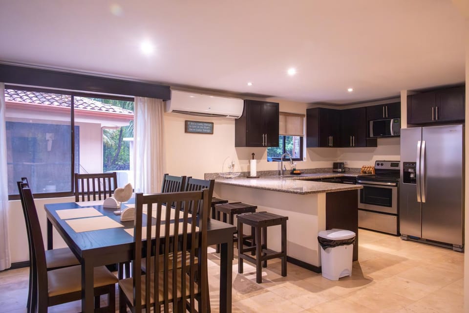 Kitchen or kitchenette, Dining area, dishwasher, oven, stove, air conditioner