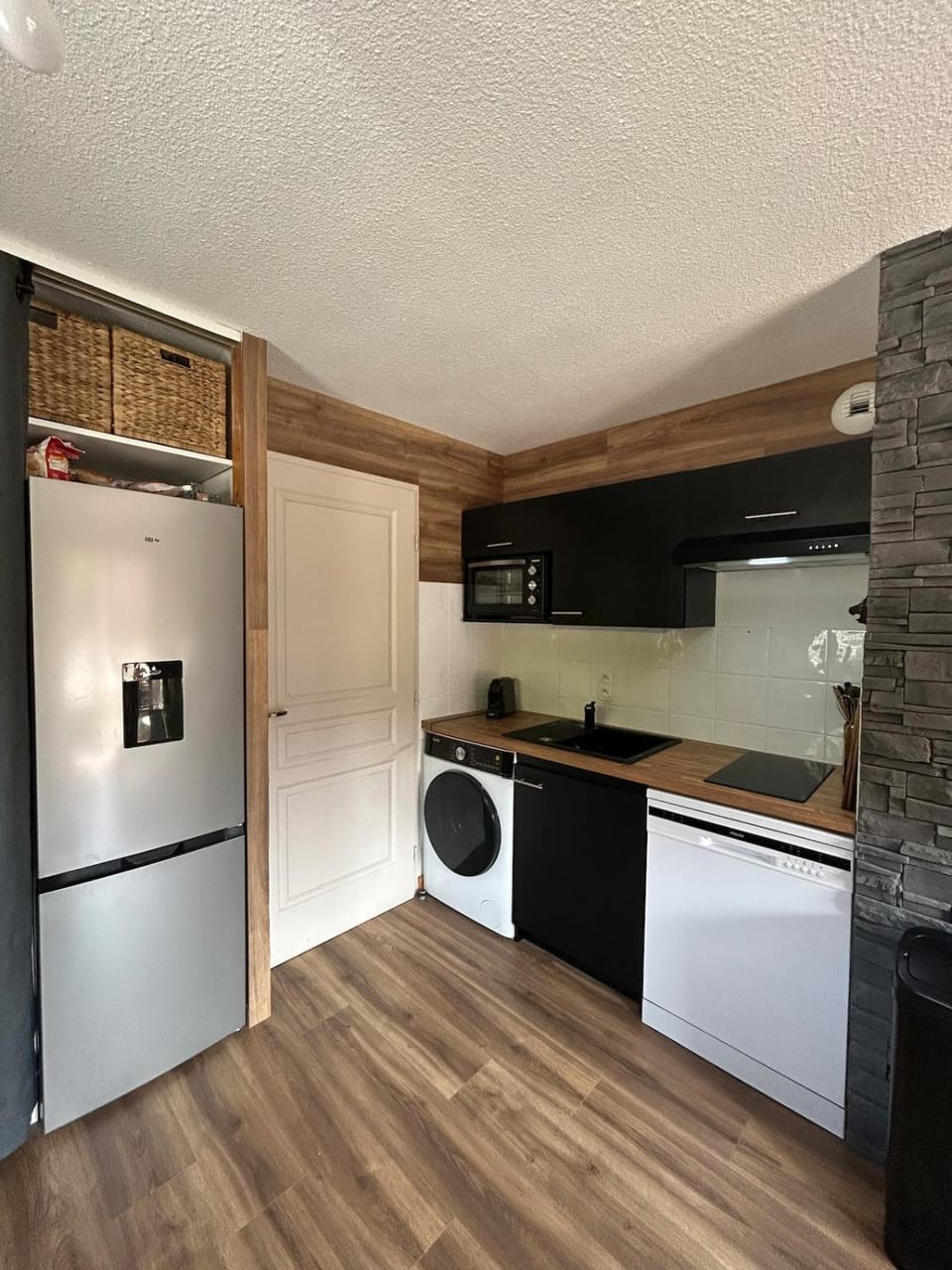 Kitchen or kitchenette, dishwasher, oven, stove, toaster, washing machine, dryer