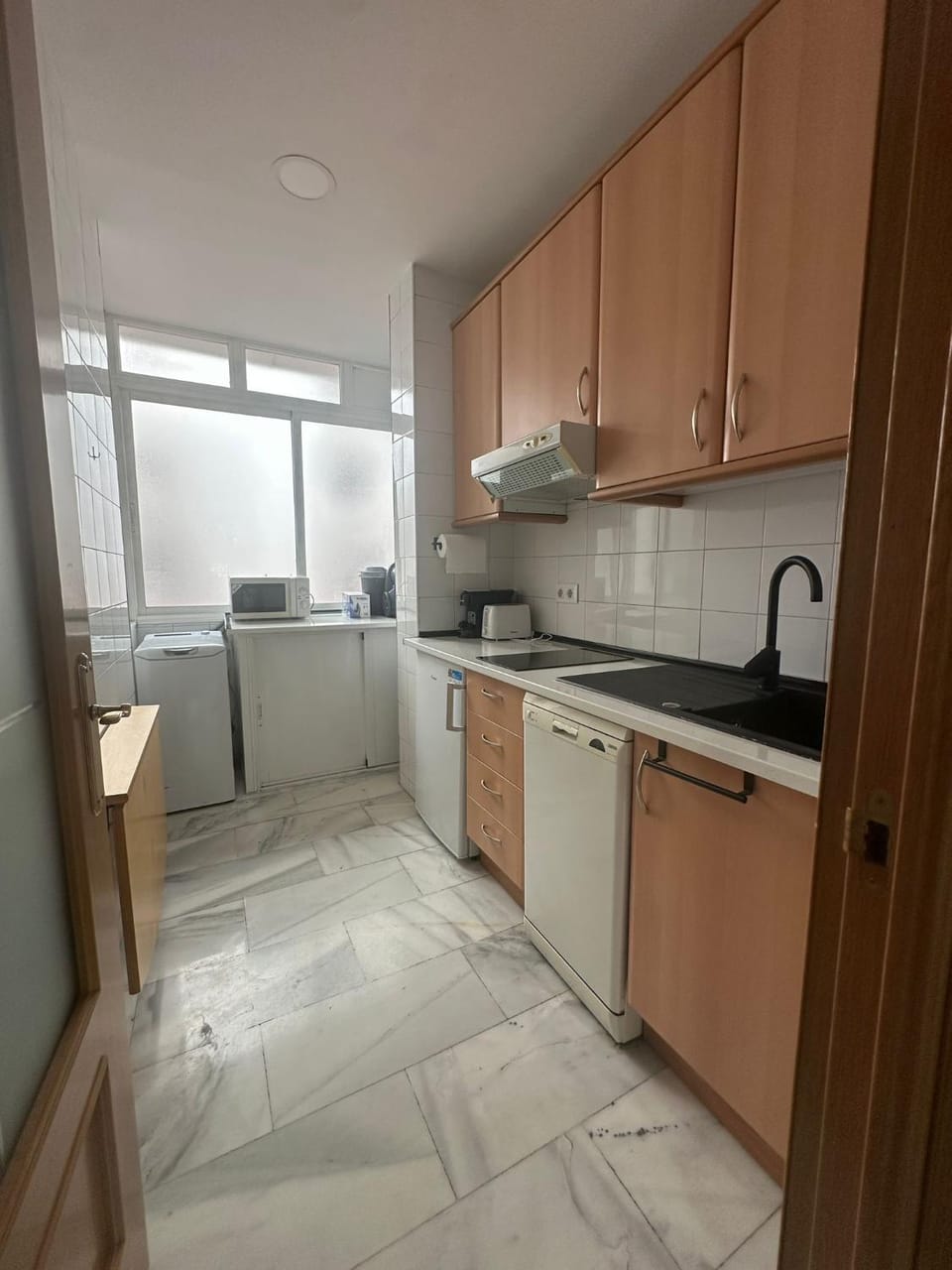 Kitchen or kitchenette, dishwasher, stove