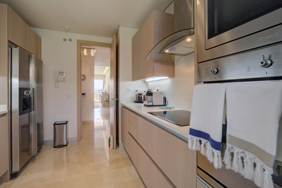 Kitchen or kitchenette, dishwasher, oven, stove