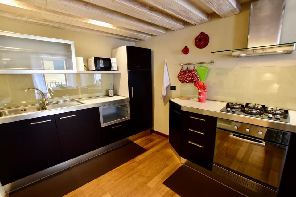Kitchen or kitchenette, microwave, oven, stove, toaster