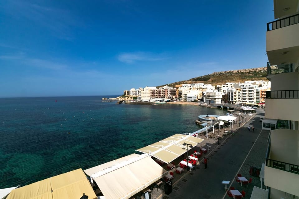 Property building, Nearby landmark, Day, Natural landscape, Beach, City view, Sea view