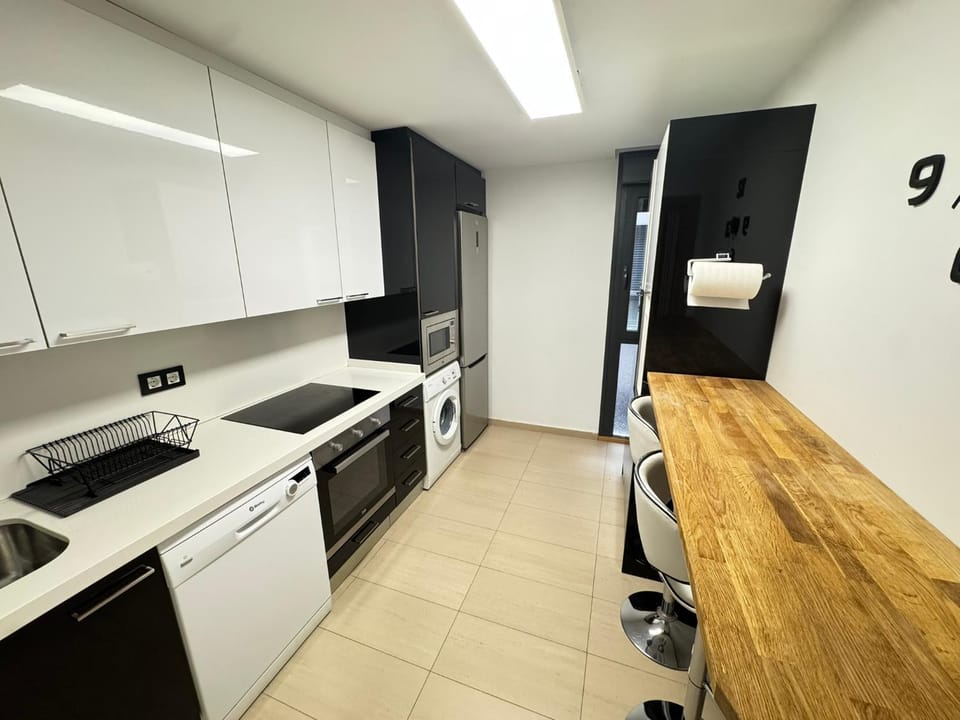Kitchen or kitchenette, dishwasher, oven, stove
