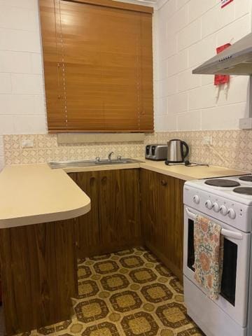 Kitchen or kitchenette, stove, toaster