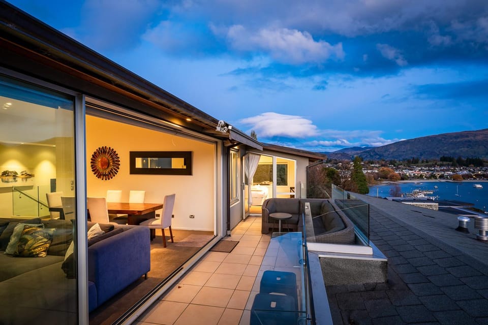 Property building, Patio, Night, Natural landscape, View (from property/room), Balcony/Terrace, Living room, Seating area, Lake view, Mountain view