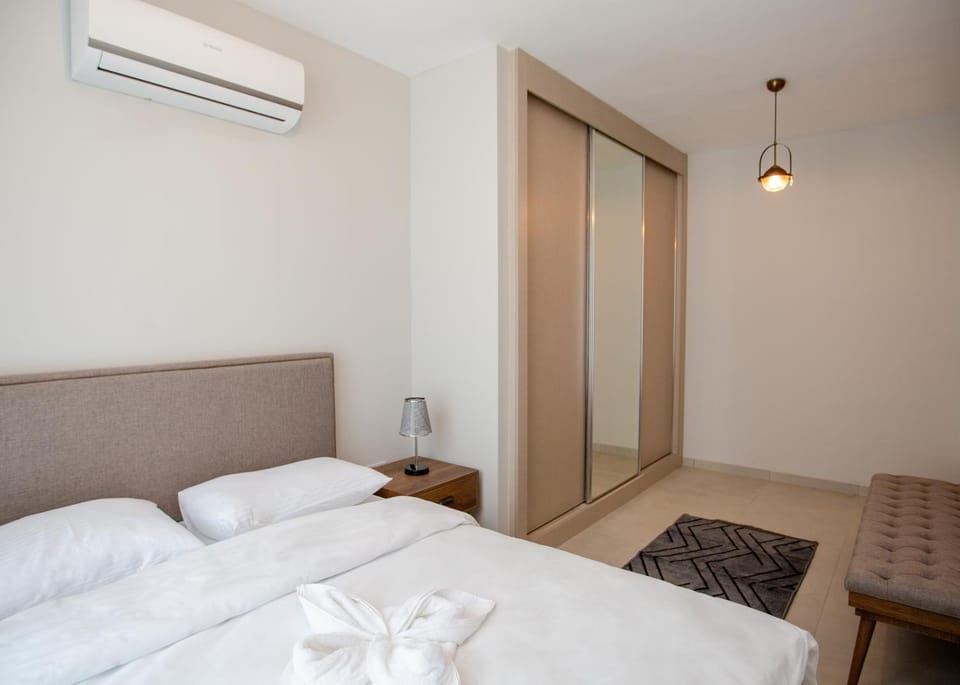 Bed, Bedroom, towels, wardrobe, air conditioner