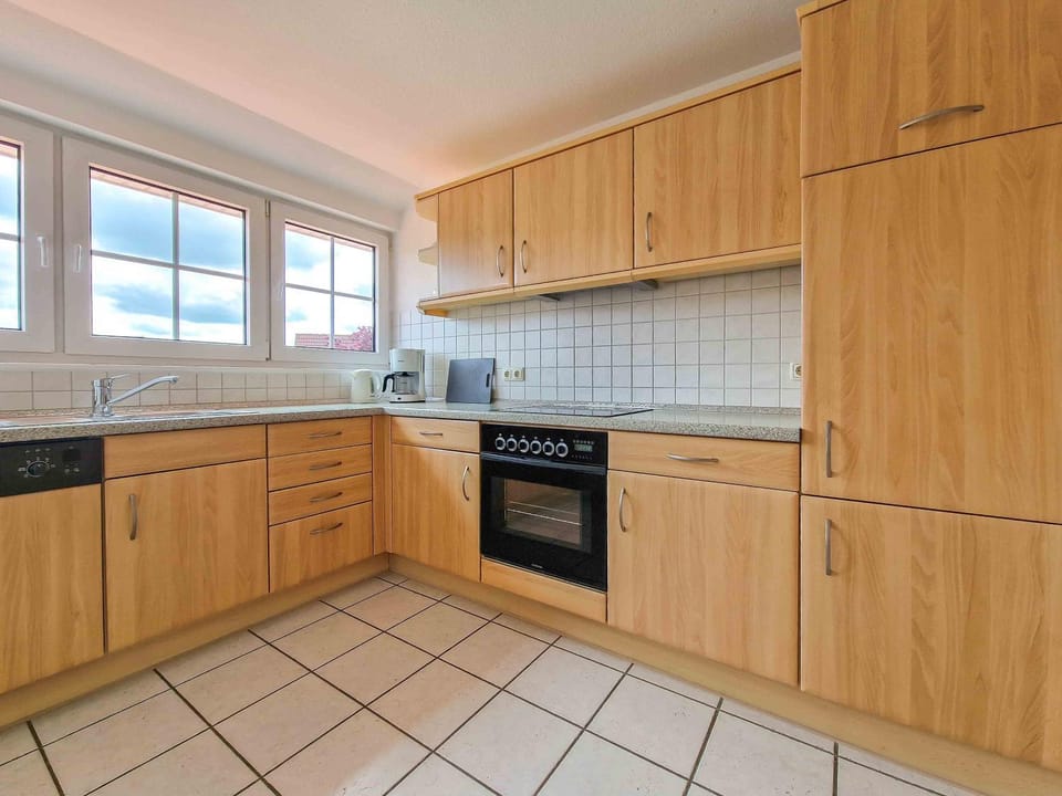 Kitchen or kitchenette, dishwasher, oven, stove, toaster