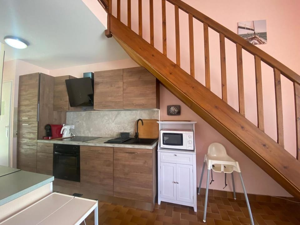 Kitchen or kitchenette, stove, toaster