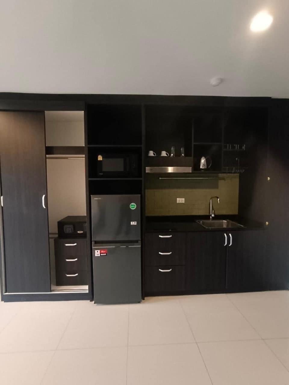 Kitchen or kitchenette, microwave, safe, stove, wardrobe