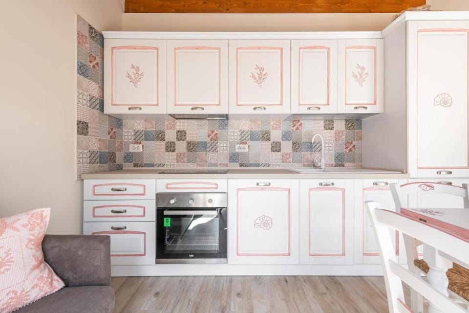 Kitchen or kitchenette, dishwasher, oven, stove