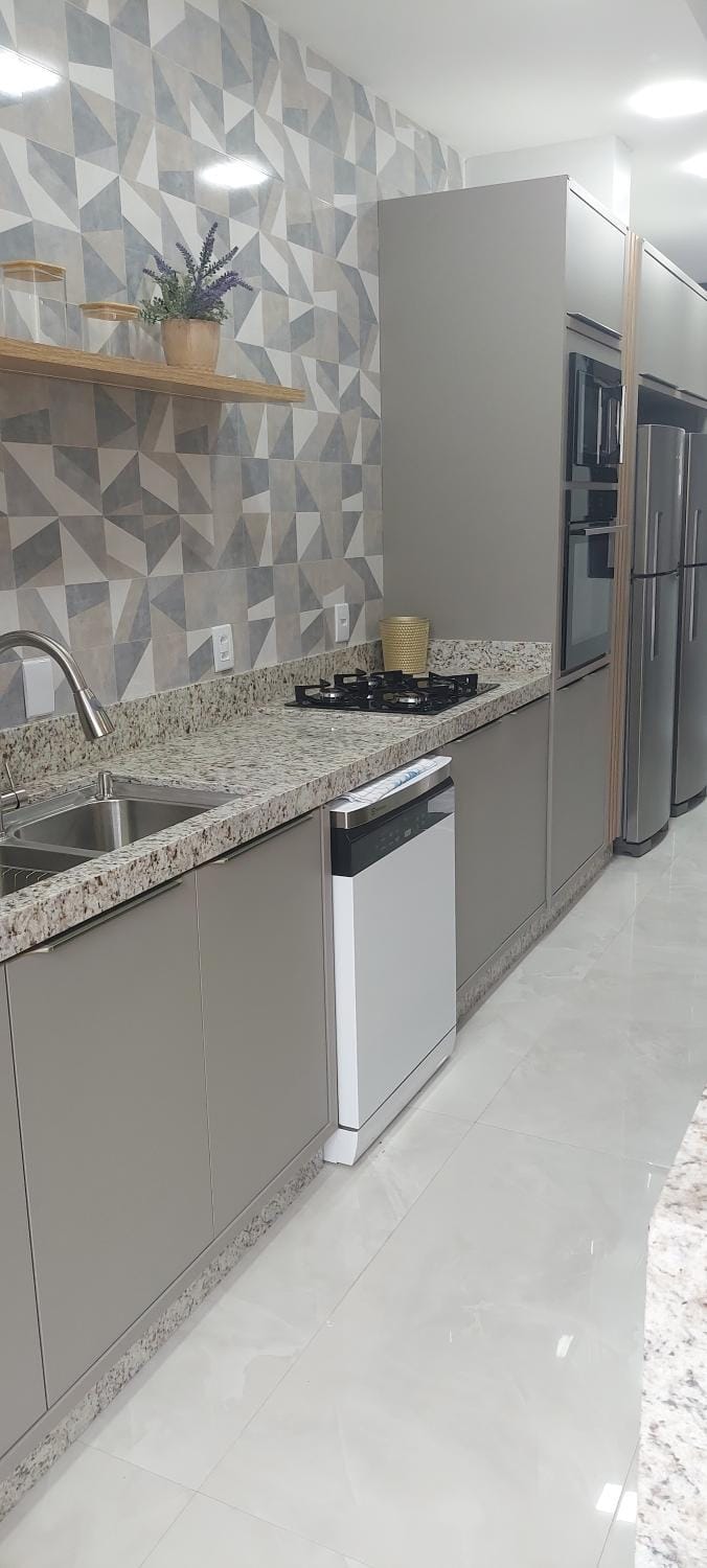 Kitchen or kitchenette, dishwasher, oven, stove