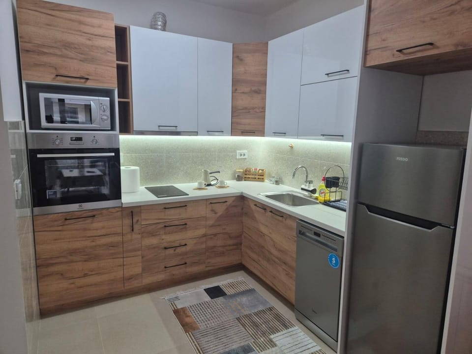 Kitchen or kitchenette, dishwasher, oven, stove, toaster