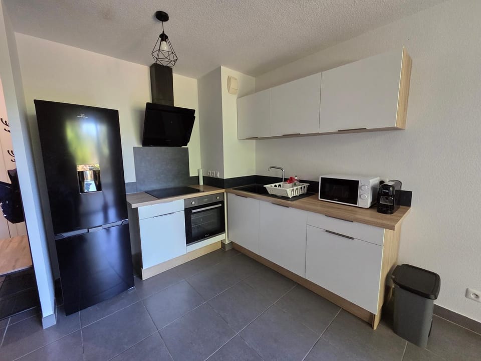 Kitchen or kitchenette, dishwasher, oven, stove, toaster