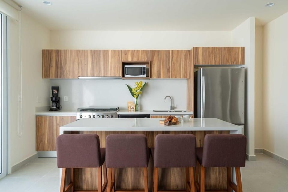 Coffee/tea facilities, Kitchen or kitchenette, dishwasher, furniture, microwave, oven, stove