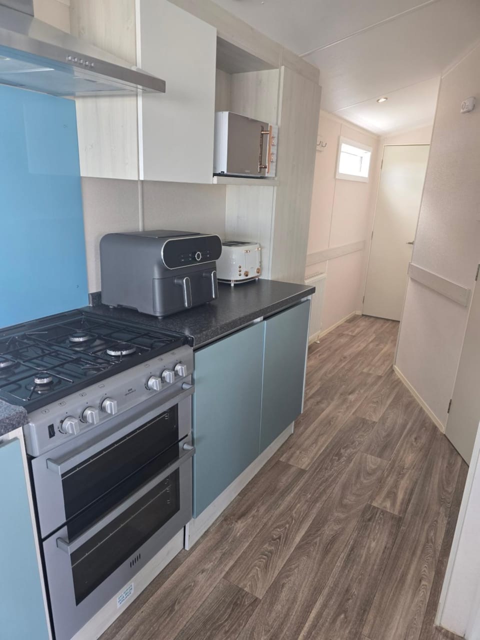 Kitchen or kitchenette, oven, stove, toaster